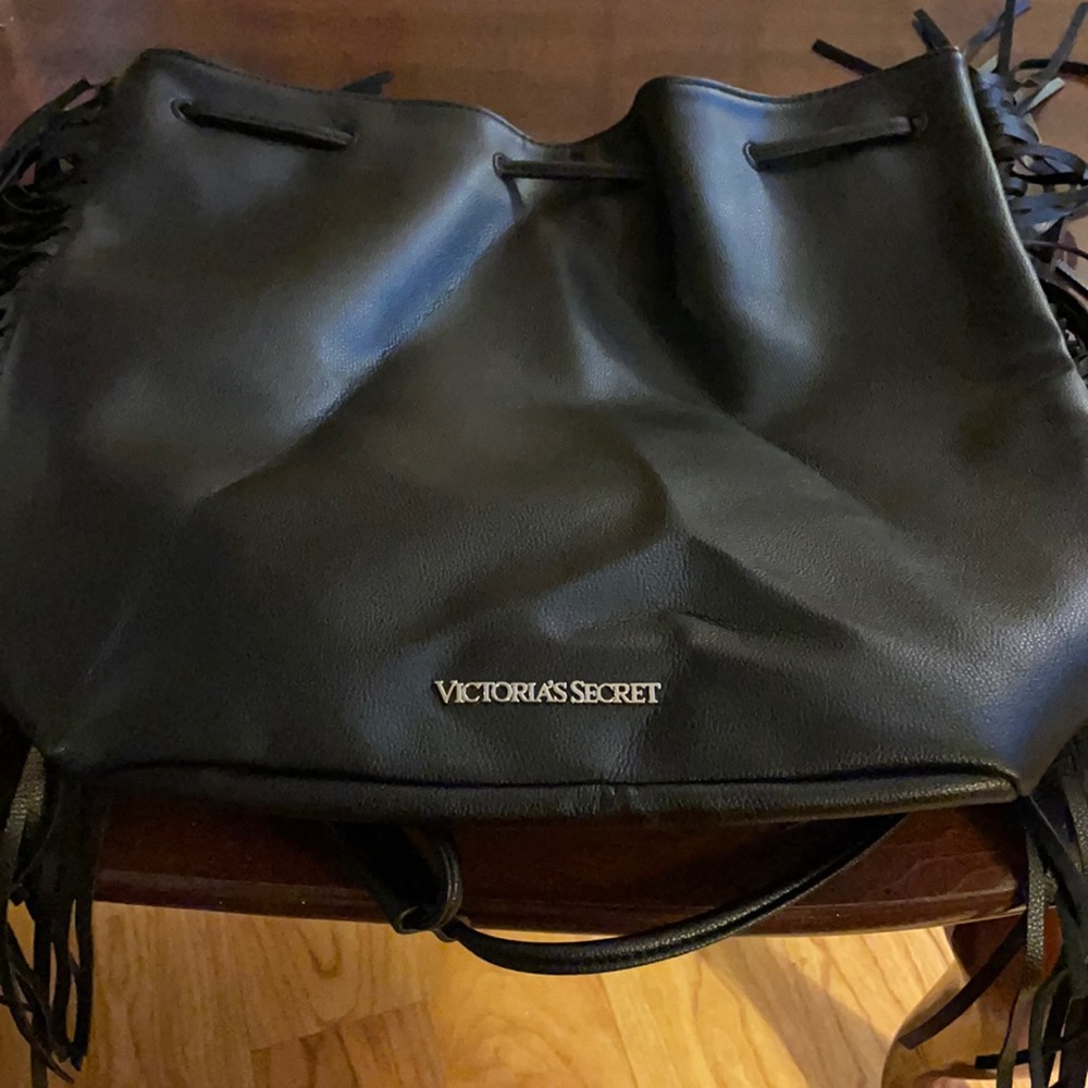A new Victoria Secret drawstring fringe backpack size 15 in wide 13 in tall
